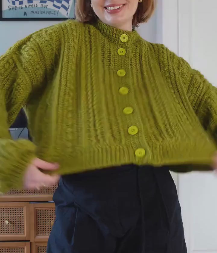 Cable cardigan video — lower-face crop